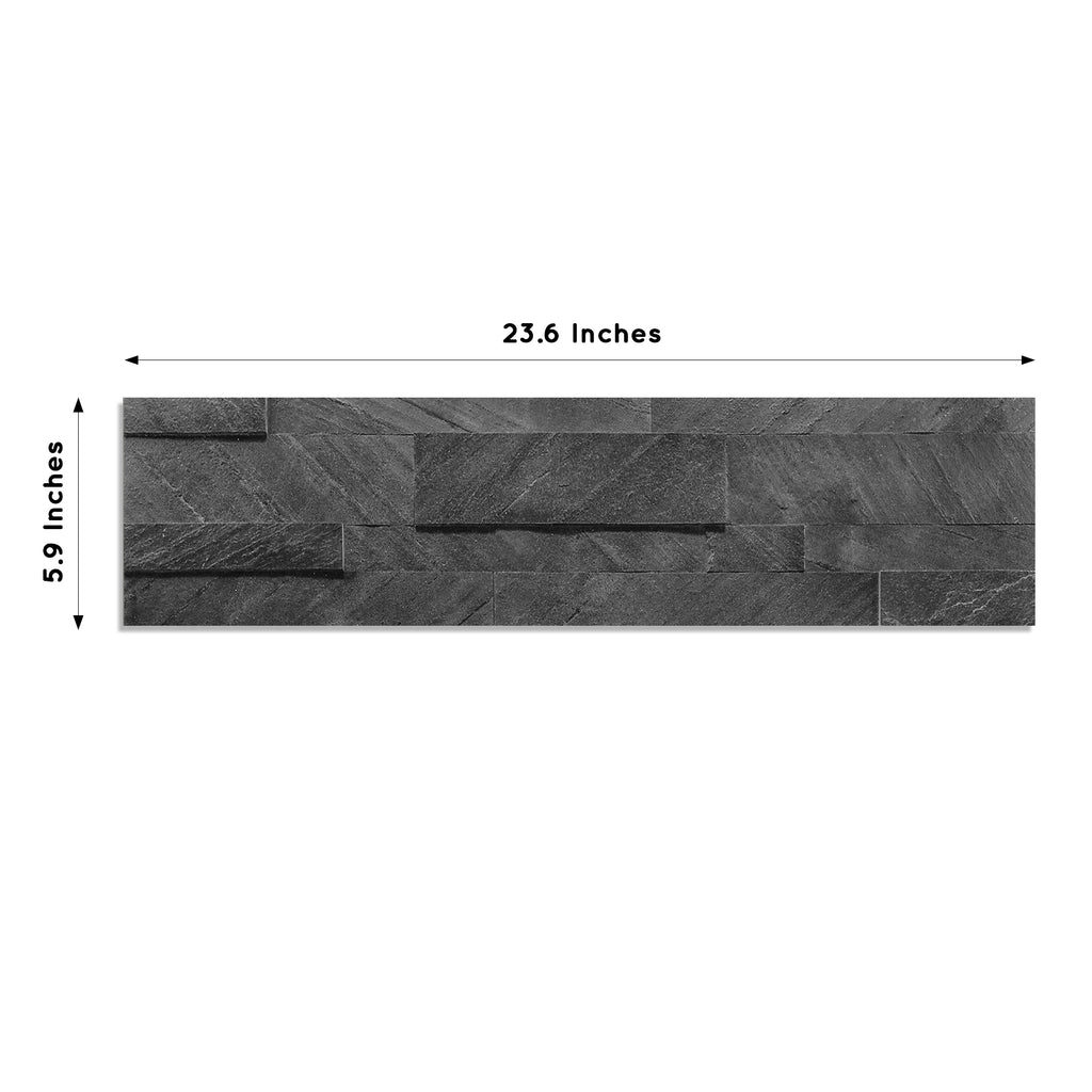 A product image of dark grey colored Shadow Grey peel and stick self-adhesive real stone wall tiles from stoneflex showing the dimensions of each tile measuring 23.6 x 5.9 inches.